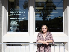 Amanda LePage, a senior manager at the Saskatoon Public Library, stands in front of the outreach support window at the Frances Morrison branch downtown.