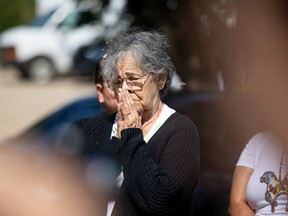 Dawn Walker's mom Theresa Walker listens to FSIN Vice Chief Heather Bear's words during the second FSIN press conference at Chief Whitecap Park where the search continues for Dawn Walker and her 7-year-old son Vincent Jansen who went missing Friday evening. Photo taken in Saskatoon, Sask. on Tuesday, July 26, 2022.