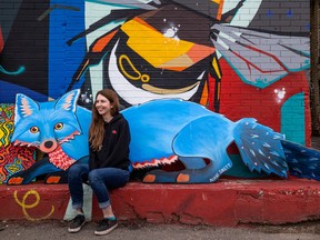 SASKATOON, SK–AUGUST 2/2022 – 0803 news drinkle art q&a – Nikki Sirett sits with her art piece Big Blue Fox outside the Drinkle building, where her artwork is being added this week. Photo taken in Saskatoon, SK on Tuesday, August 2, 2022.