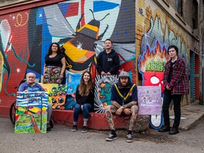 SASKATOON, SK–AUGUST 2/2022 – 0803 news drinkle art q&a – Artists Paul Sisetski, Ailah Carpenter, Nikki Sirett, Noah Roy, Sleazy, and Charli (left to right) are all being featured on the Drinkle building art wall. Photo taken in Saskatoon, SK on Tuesday, August 2, 2022.