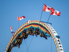 Fair-goers ride the Ring of Fire at the Saskatoon Ex, which runs from Aug 9 to 14. Photo taken in Saskatoon, Aug. 9, 2022.