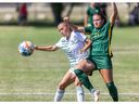 The University of Saskatchewan Huskies' Alyssa D'Agnone (21) fights for the ball with the University of Alberta Pandas' Abbie Sheflo (21) during their match in Saskatoon, SK on Saturday, August 20, 2022.