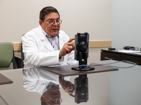 Dr. Ivar Mendez speaks to a patient via a specialized program that allows management of pain remotely. Dr. Mendez is the head of the Department of Surgery at the University of Saskatchewan.