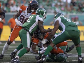 BC Lions running back James Butler (24) carries the ball as he gets tackled by the Saskatchewan Roughriders defence during the first half of CFL action at Mosaic Stadium on Friday, July 29, 2022 in Regina.