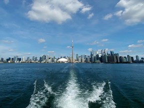 Ferry service to Toronto Island will be reduced for the rest of the summer following a weekend collision at the downtown terminal that injured a dozen people. The Toronto skyline is seen from a ferry on Friday, August 28, 2020.