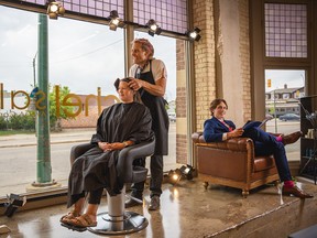 In action in the front window of the new location of Chel Salon as of May 2022 in the Fairbanks-Morse Building in downtown Saskatoon.