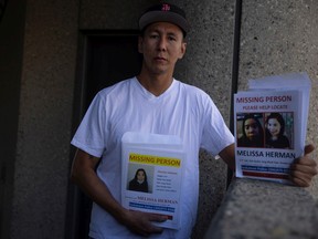 Cornell Herman, who stands with a missing persons poster of his sister Melissa Herman, has come to Regina from Saskatoon to look for his relative based on a recent sighting of her. Herman stands in front of the Delta Hotel on Tuesday, August 30, 2022 in Regina. KAYLE NEIS / Regina Leader-Post