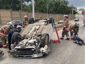 A driver whose car rolled over on Idylwyld Dr. at the Lorne Ave. exit in Saskatoon on Aug. 5 2022 had to be rescued by firefighters.