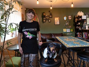 April Watson sits for a photo with her dog Lucky in Manifestations Café which she opened in June in Riversdale to offer blends of teas from around the world. Photo taken in Saskatoon, Sask. on Thursday, Aug. 4, 2022.