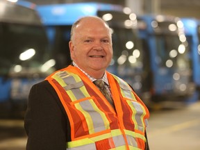 Former City of Saskatoon director of transit Jim McDonald stands with city busses in the city’s civic operations centre on Dec. 6, 2018.