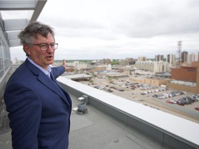Alan Wallace, the former director of planning and development for the City of Saskatoon, points out a location for a possible new arena in downtown Saskatoon from the upper levels of the Holiday Inn in this May 2018 photo.