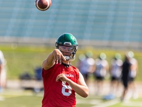 Huskies quarterback Mason Nyhus throws the football during an August training-camp session.