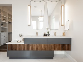 Warm tones of wood combine with contemporary greys and white to create a magazine worthy ensuite off the principal bedroom.