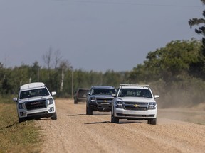 RCMP vehicles drive through James Smith Cree Nation after reports of a possible sighting of Myles Sanderson on the reserve. Photo taken in James Smith Cree Nation, SK on Tuesday, September 6, 2022.