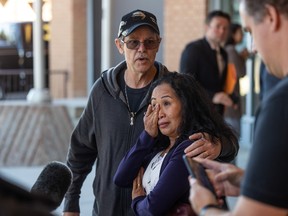 Alex, left, and Marilou Haughey speak outside of the Provincial Courthouse after a hearing for Cheyann Peeteetuce, the second person charged with the murder of Megan Gallagher.