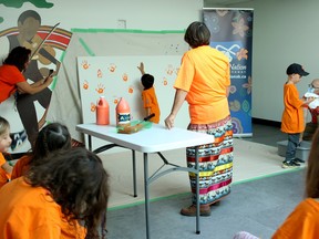 Grade 1 students from École Victoria left their mark on a canvas as part of an Orange Shirt Day event with Métis Nation–Saskatchewan on Monday. The final painting, designed as a way to remember the children impacted by residential schools, will hang in the MN–S office in downtown Saskatoon. This is one of many activities happening as part of reconciliation week in the leadup to the National Day for Truth and Reconciliation today.