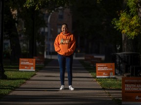 Kristin Francis, executive director of Reconciliation Regina organized volunteers to put up Orange flags and signs in Victoria Park ahead of Orange Shirt Day.