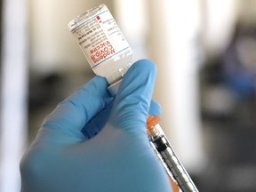 A nurse loads a syringe with the Moderna COVID-19 vaccine at an inoculation station next to Jackson State University in Jackson, Miss., Tuesday, July 19, 2022. More people in Saskatchewan will be able to book a COVID-19 bivalent booster shot on Monday.THE CANADIAN PRESS/AP-Rogelio V. Solis