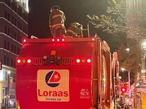 Saskatoon firefighters rescued a man trapped in the bin of an automated garbage truck just before 6 a.m. on Sept. 30, 2022.