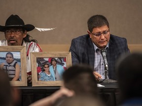 Mark Arcand, right, whose sister Bonnie Burns was killed in a series of stabbings, speaks at a news conference with family in Saskatoon on Wednesday.
