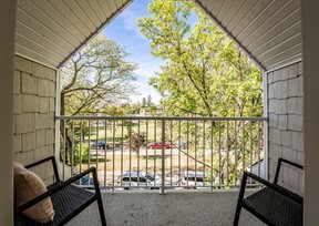 Garden doors lead to a covered balcony, offering a birds-eye view of the historic Broadway neighbourhood.