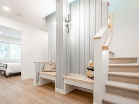 A reading nook with built-in benches on the second floor is finished in natural pine.