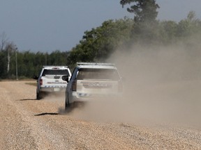 RCMP vehicles patrol James Smith Cree Nation on Sept. 6, 2022, following a possible sighting of the second person of interest in the stabbings that occurred at the James Smith Cree Nation Indigenous community and the town of Weldon.