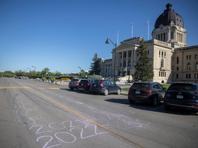 Overdose death statistics are drawn in front of the Saskatchewan Legislative Building as part of the International Overdose Awareness Day on Wednesday, August 31, 2022 in Regina. KAYLE NEIS / Regina Leader-Post
