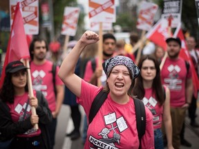 Participants chant as they march through Toronto during the Labour Day Parade on Monday, September 5, 2022.