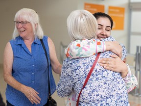 Nest president Beth Smillie (left) smiles as Rohi Rasa, a lawyer who worked in the Attorney’s General Office of Afghanistan, arrives in Saskatoon. Nest is a volunteer-run organization that helps sponsor women activists from Afghanistan, who were forced to flee their homes due to their work for women’s equality. Photo taken in Saskatoon, Sask. on Tuesday, Aug. 30, 2022.