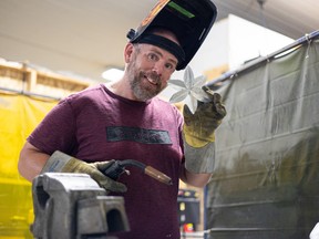 Will Livingston works on his metal flower creations in his workshop at Saskatoon Makerspace.
