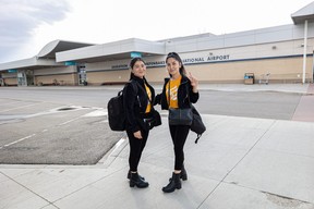 Sisters Rejna Ahmadi (left) and Shakiba Ahmadi stand for a photo in front of the Saskatoon International Airport before setting off on their next adventure to start a life in Toronto on Aug. 27, 2022.