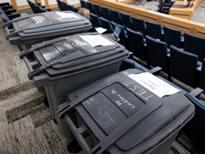 Three sizes of test garbage bins are on display during a committee meeting at Saskatoon City Hall.