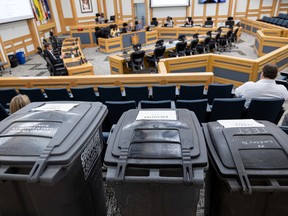 Three sizes of test garbage bins are on display during a city council meeting. Photo taken in Saskatoon, Sask. on Tuesday, September 6, 2022.