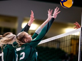 University of Saskatchewan Huskies setter Averie Allard (12) and middle Mandi Fraser (10) are seen here in a file photo from March.