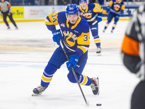 Saskatoon Blades forward Conner Roulette (34) carries the puck down the ice during WHL action against the Lethbridge Hurricanes in Saskatoon on Tuesday, October 4, 2022.