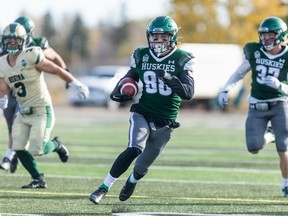 Huskies receiver Rhett Vavra runs the ball during Canada West football action against the Regina Rams Saturday. The Huskies defeated the Rams 23-20.