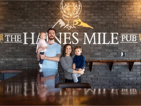 Ryan and Desiree Sutherland stand with their children Atlin and Hendrix. The family runs the Haines Mile Pub, which blends together the best of Saskatchewan (where Desiree is from) and the Yukon (where Ryan is from) to provide wild game, fresh fish and unique twists on classic cocktails. Photo taken in Saskatoon, SK on Tuesday, October 18, 2022.