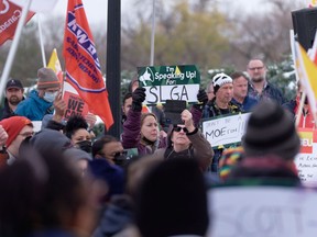 Members of various unions gather at a rally at the Legislative Building. Yesterday the provincial government announced the closure of all SLGA retail liquor stores in the province.