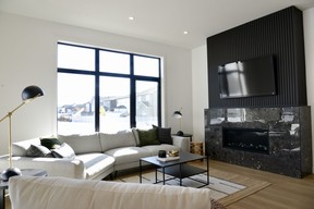 The lounge at 510 Hamm Crescent is spacious, bright and inviting – a lovely space for entertaining guests or simply relaxing by the fire.