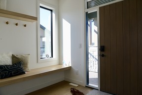 Welcoming guests will be a joy with a spacious entrance with thoughtful details, such as the extra window and a built-in bench for putting on shoes.