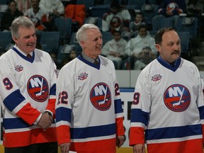 (L-R) Clark Gillies, Mike Bossy and Bryan Trottier of 