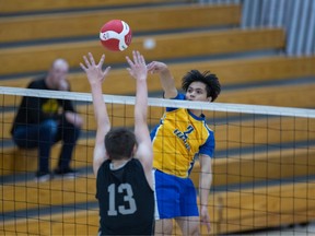 Saskatoon high school volleyball action from September 14, 2022 featuring E.D. Feehan and St. Joseph. Photo by Victor Pankratz.