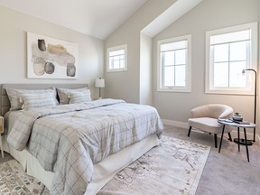 The primary suite in Westbow Homes’ parade home at 908 Feheregyhazi Blvd. is an inviting personal retreat. Located on its own level over the attached double garage, the primary bedroom features a soaring vaulted ceiling, spa-inspired ensuite and a walk-in closet with a 16-foot ceiling.