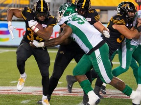 Hamilton Tiger Cats running back Wes Hills (34) rushed for 132 yards in Friday's 18-14 win over the Saskatchewan Roughriders.