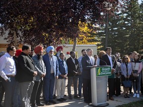 Trade and Export Development Minister Jeremy Harrison stands with community partners and newcomers for an event on Wednesday, September 28, 2022 in Regina. KAYLE NEIS / Regina Leader-Post