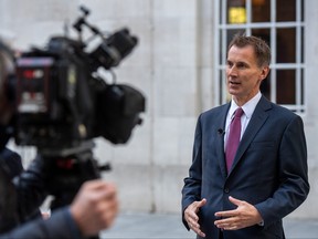 Chancellor of the Exchequer, Jeremy Hunt, takes part in a TV interview outside BBC Broadcasting House on Oct. 15, 2022 in London.