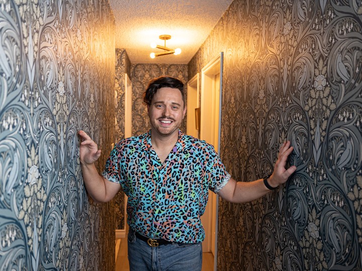  Daniel Dalman stands for a photo in the hallway of his Saskatoon condo