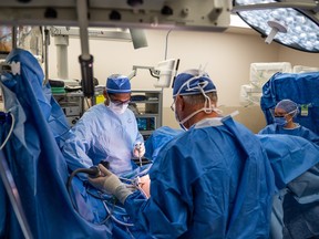 Dr. Varun Bathini prepares a cancer patient for robotic surgery at St. Paul's Hospital in Saskatoon on Oct. 24, 2022.