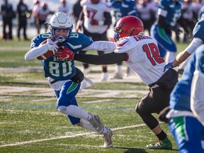 Emmett Box of the Bishop Mahoney Saints runs the football against the Weyburn Eagles in the provincial 5A final in Saskatoon on Friday.